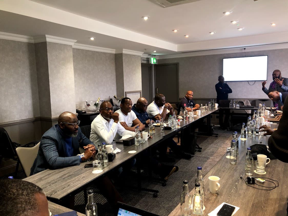 MoHC members engaged in a strategic business meeting and discussion